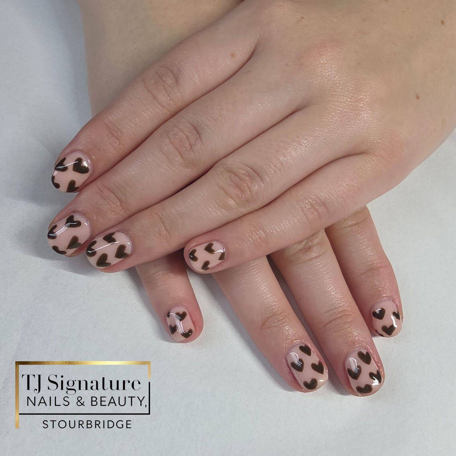 Soft nude builder base topped with glossy chocolate hearts — simple, sweet, and full of charm. Perfect for everyday wear or a little love-inspired set any time of year 💗