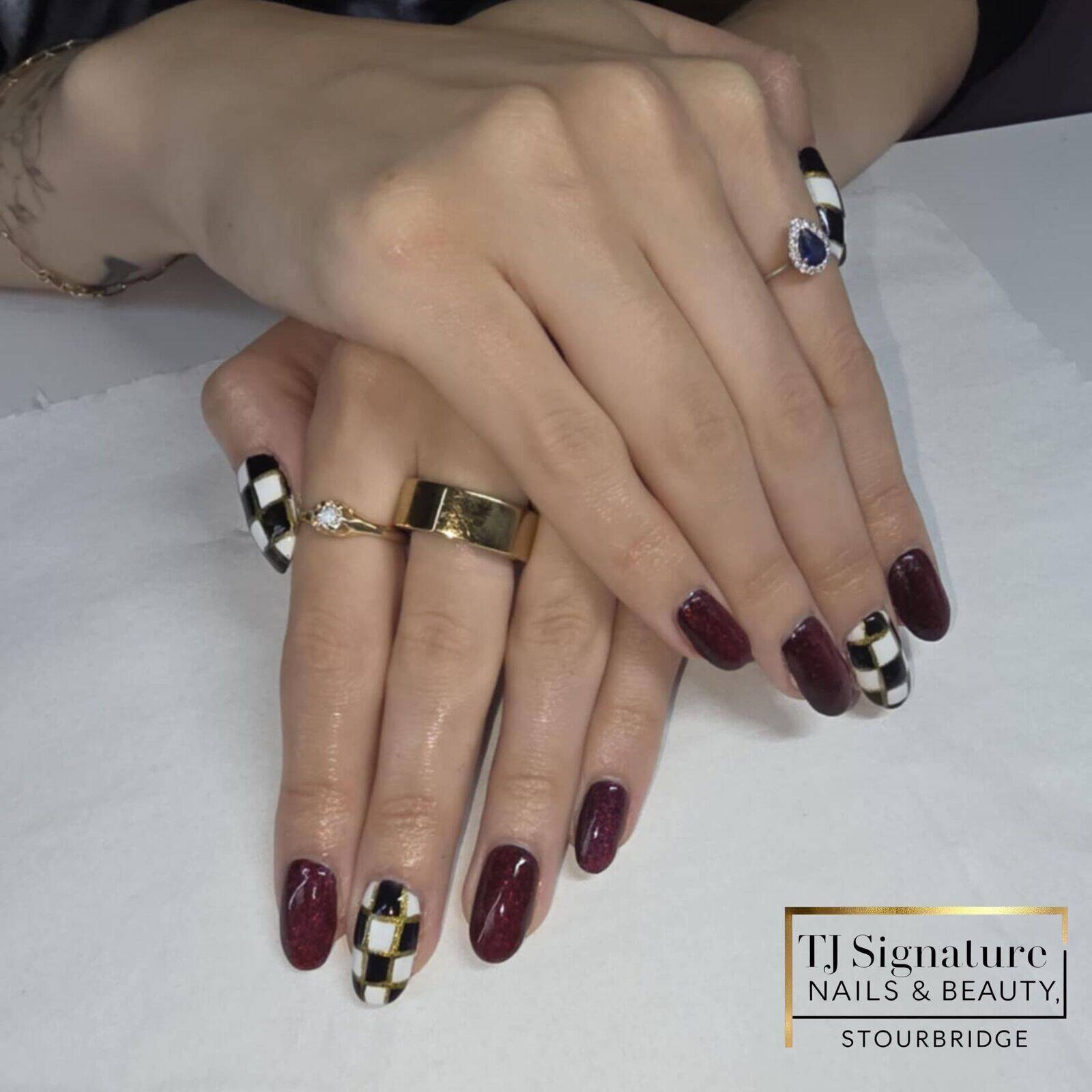 Autumn elegance — deep berry tones and gold accents paired with bold checkerboard detail.