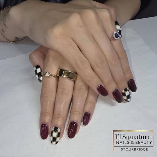 Autumn elegance — deep berry tones and gold accents paired with bold checkerboard detail.