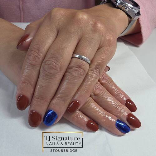 Client-chosen autumn tones with a pop of blue sparkle 💙 — added a bit of bling for a party ✨