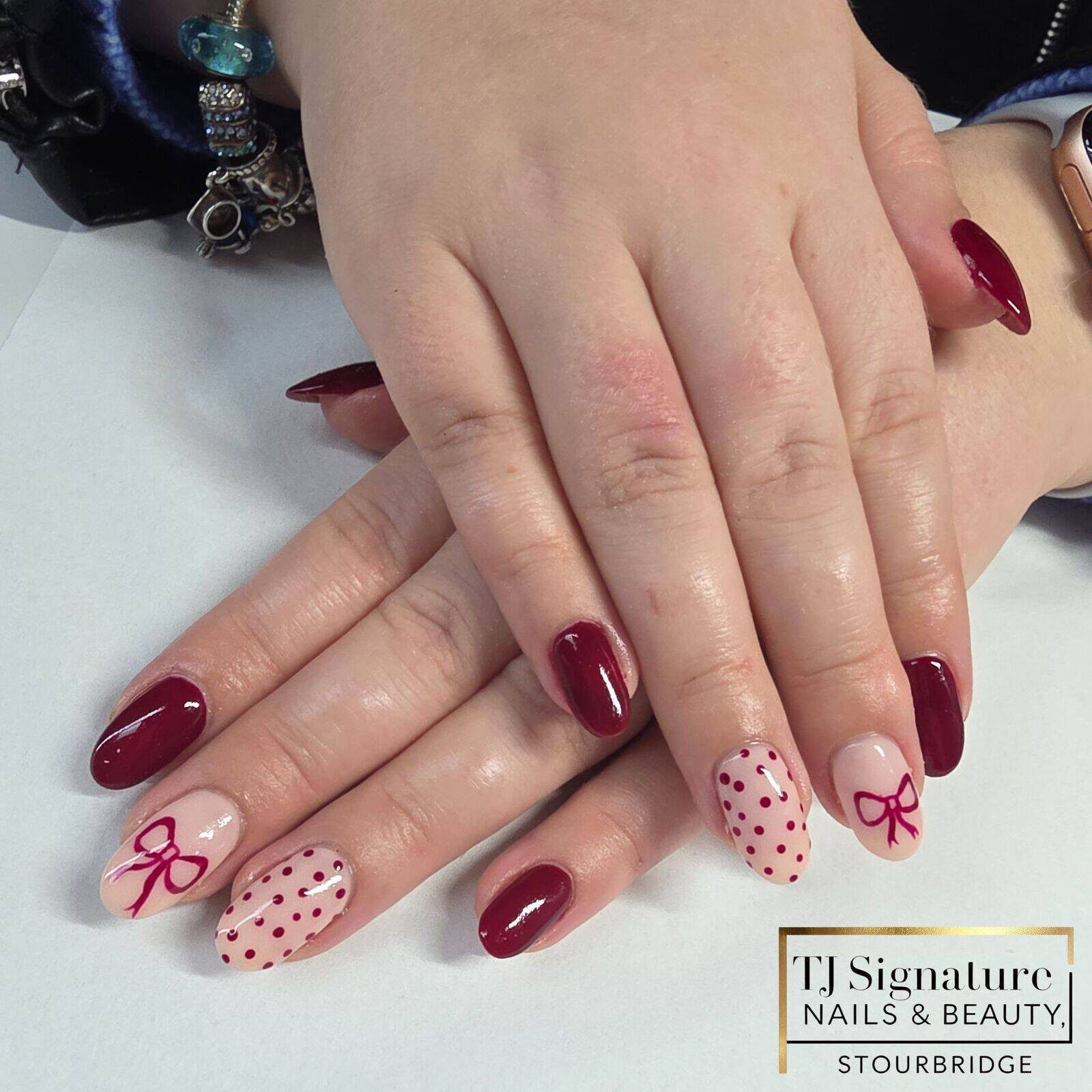 Classic red tones with subtle bow and polka-dot accents — elegant with a touch of fun. 🎀