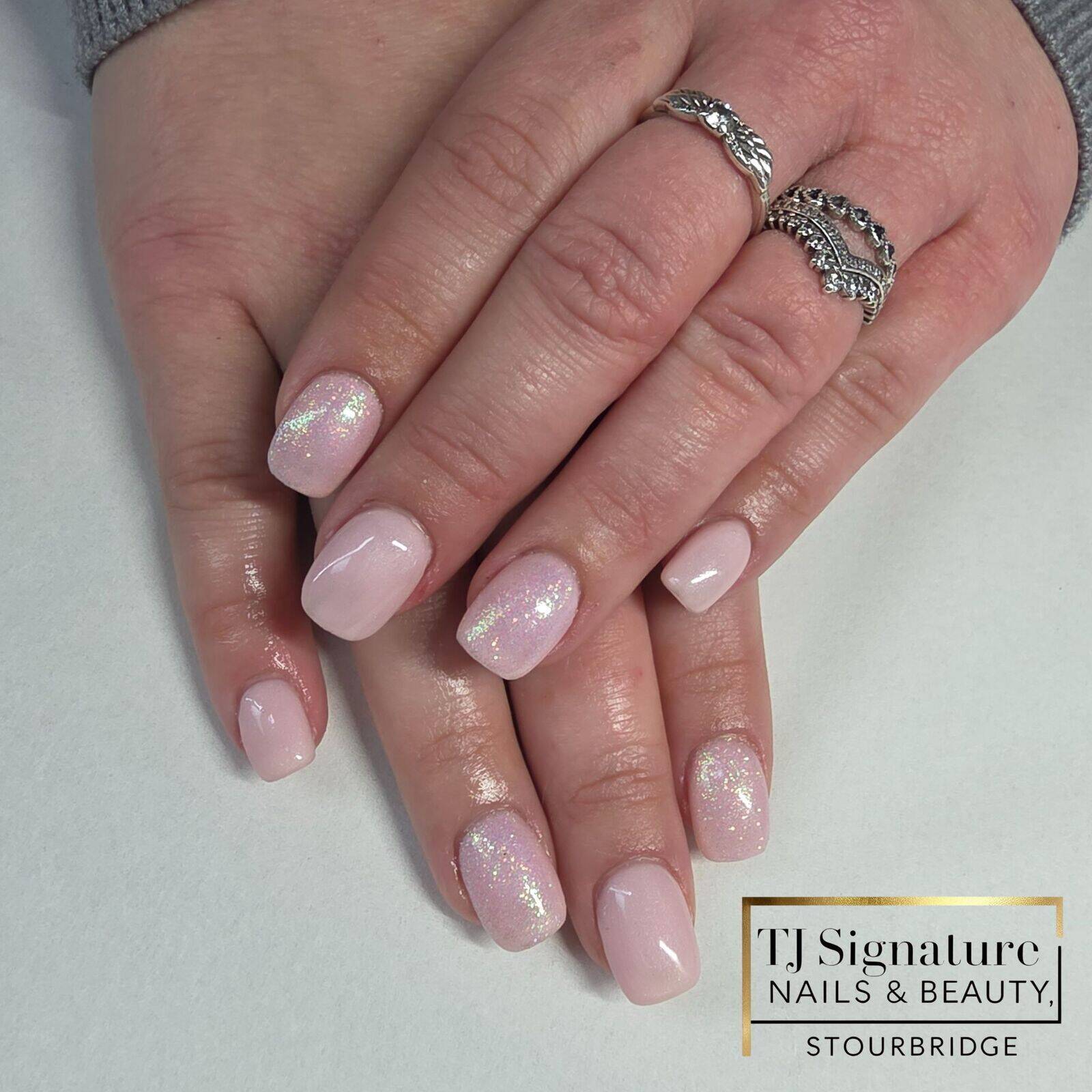 A natural blush base finished with a subtle iridescent shimmer — elegant, timeless and perfect for clients who love a clean, feminine look.