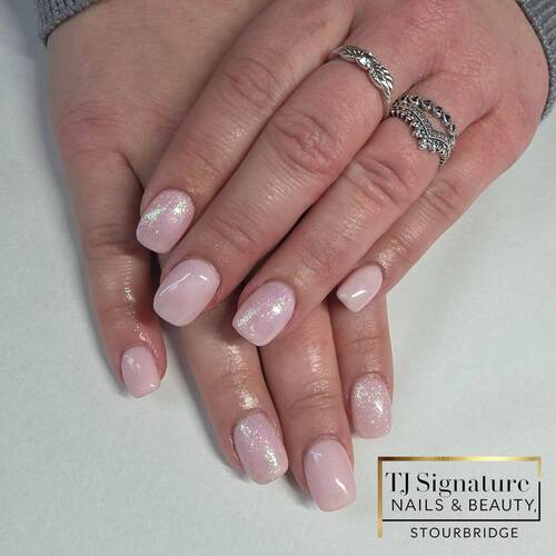 A natural blush base finished with a subtle iridescent shimmer — elegant, timeless and perfect for clients who love a clean, feminine look.